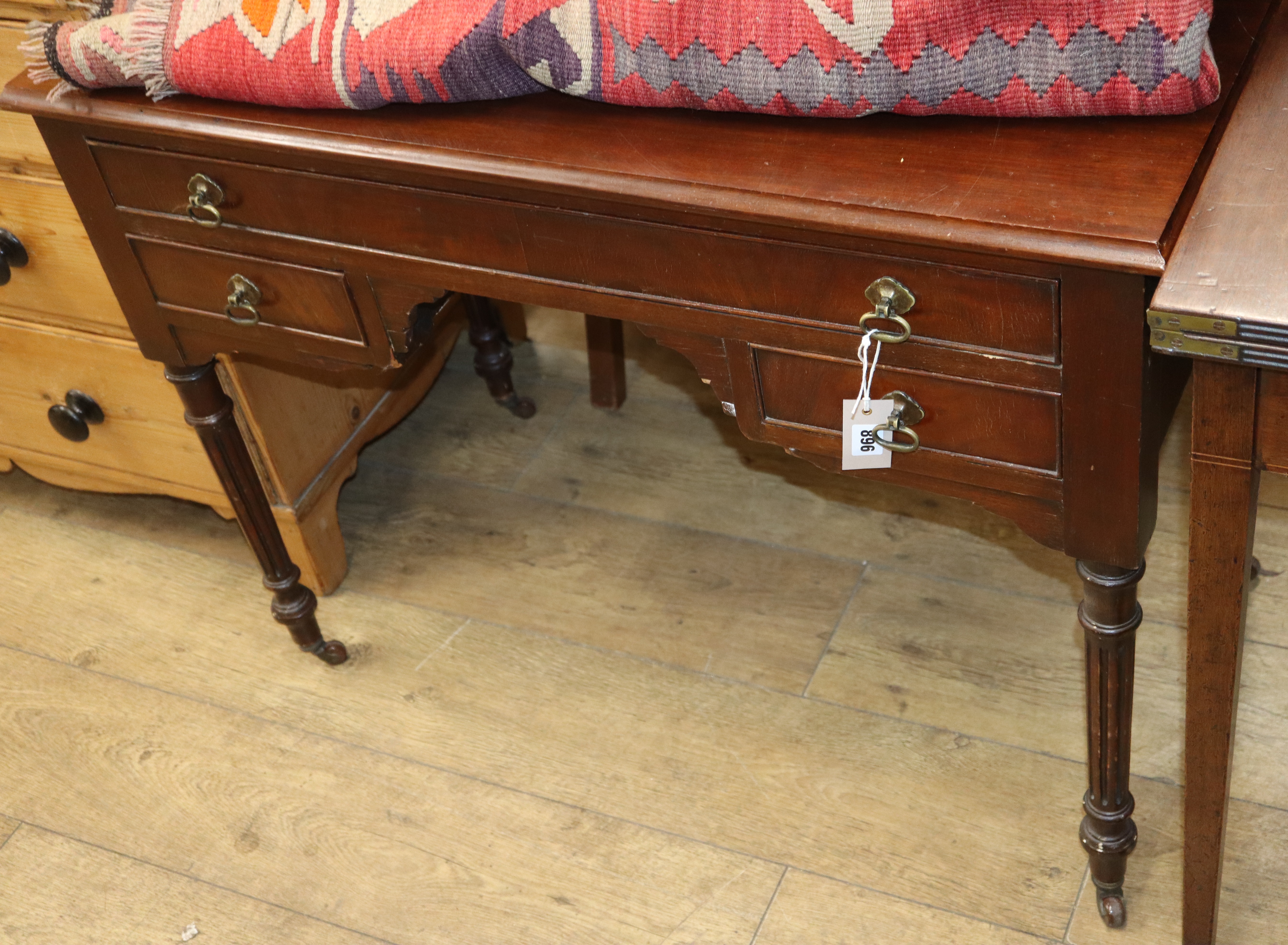 A 1920s mahogany kneehole desk, width 138cm, depth 64cm, height 227cm